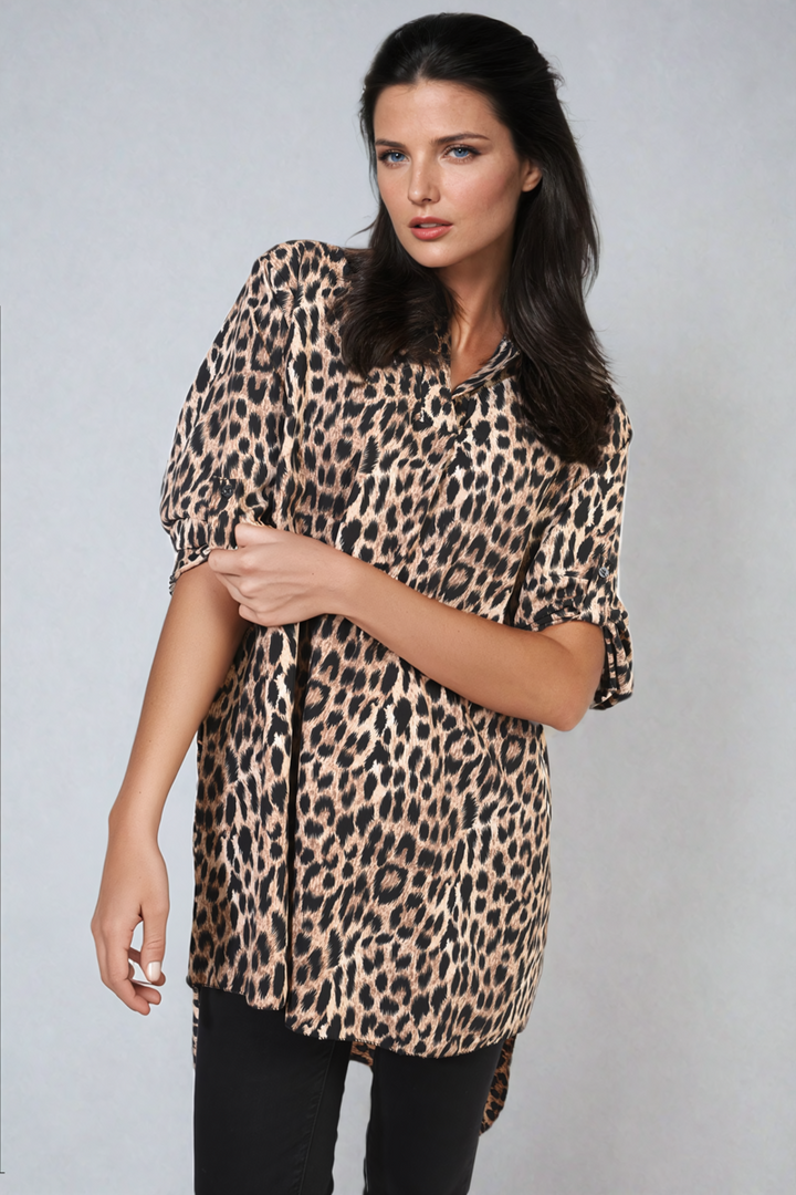 Woman wearing an Oversized Leopard Print Button Down Batwing Sleeve Top, showcasing its relaxed style with batwing sleeves, ideal for casual or evening wear.