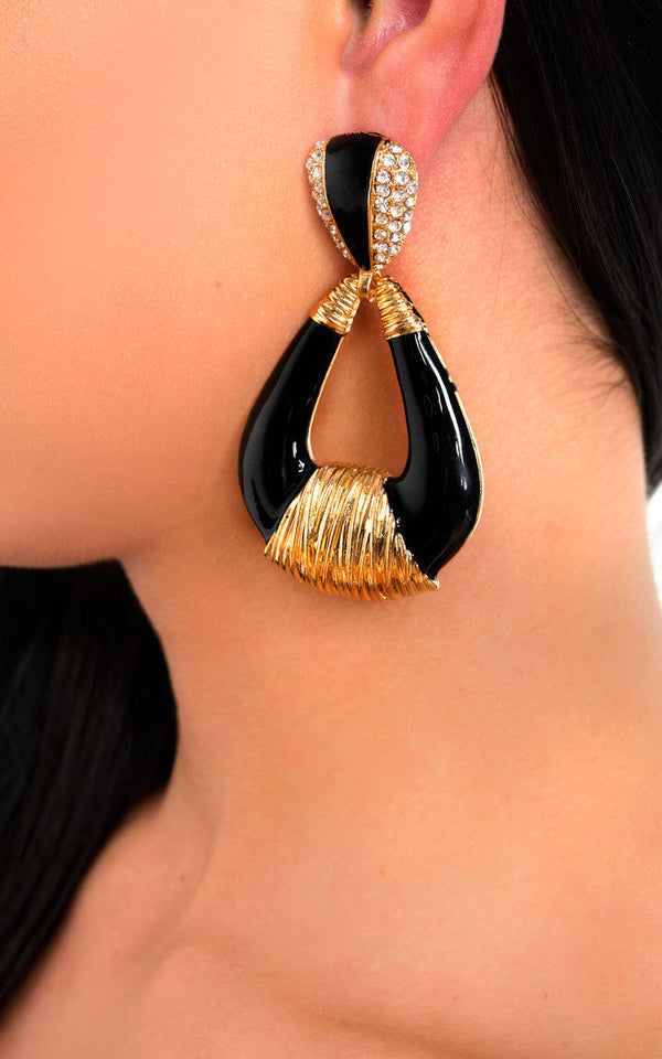 Statement Tear Drop Earrings with gold detail and diamante embellishments on a woman's ear, showcasing a stylish accessory from Holiday-clothes.co.uk.