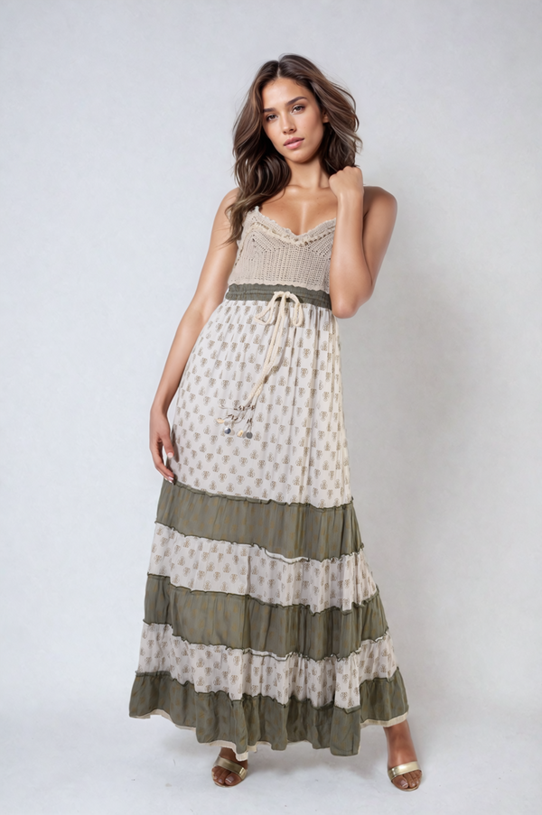 Woman wearing a Tiered Crochet Strappy Maxi Dress with tiered skirt and crochet details, showcasing a boho-inspired style perfect for summer outings.