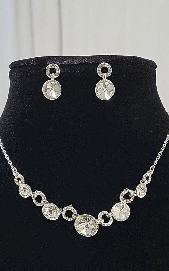 Diamante Necklace and Earrings Set displayed on a mannequin, featuring sparkling crystals, perfect for adding glamour to any outfit.