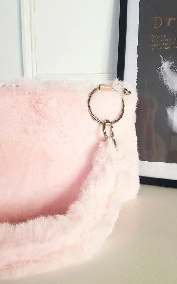 Faux Fur Shoulder Bag with Fluffy Strap, featuring a ring detail and metal accents, ideal for versatile styling and quick access to essentials.