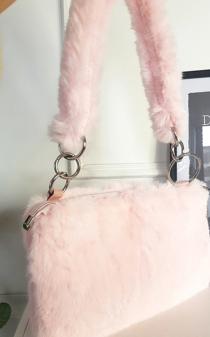 Faux Fur Shoulder Bag with Fluffy Strap, featuring silver ring accents and a plush texture, perfect for versatility in any stylish wardrobe.