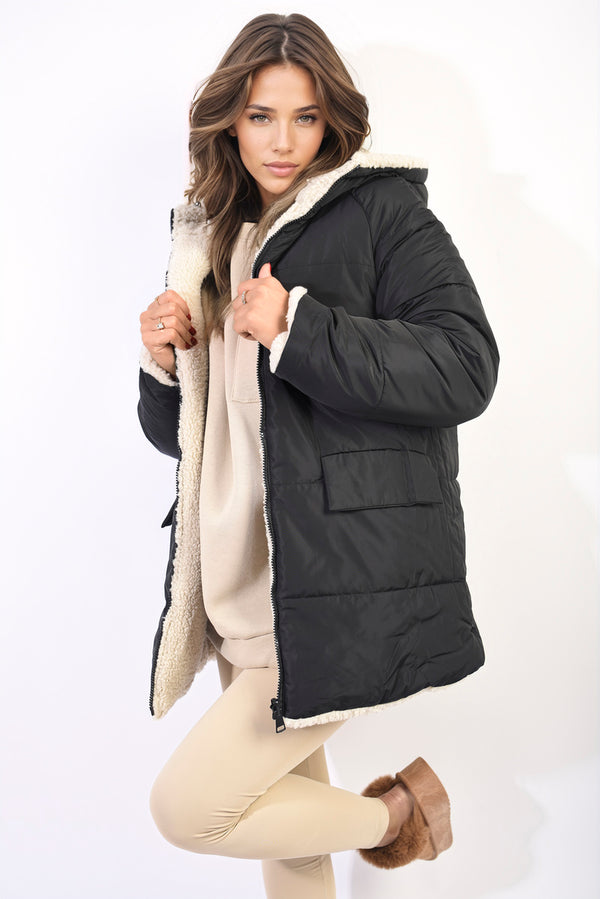 Woman wearing Stephanie Reversible Padded Jacket, showcasing its sleek design and versatility for stylish warmth.