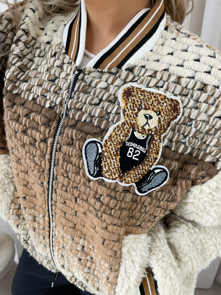 Teddy Textured Bomber Jacket with teddy bear patch, offering plush style and warmth for casual outings.