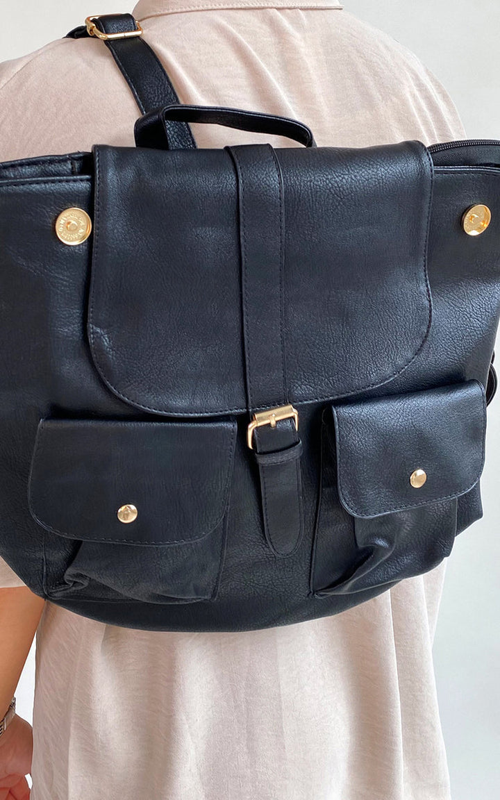 Faux Leather Handbags: Black shoulder bag with gold buttons, featuring a large main compartment and stylish design for versatile use.