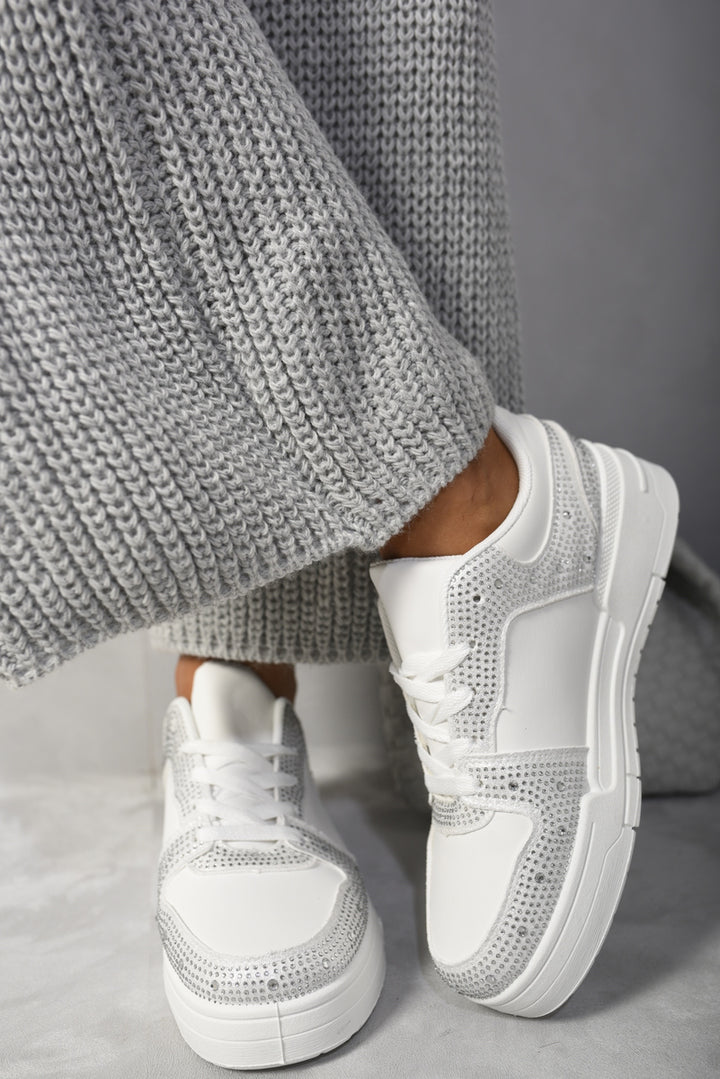 Sparkly Crystal Embellished Trainers adorned with rhinestones, capturing light and adding glam to any outfit. Ideal for style and comfort seekers.