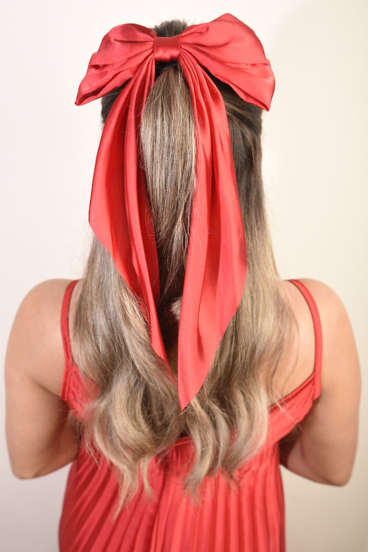 Elegant Big Bow Hair Clips in a woman's hair, showcasing a chic and sophisticated hairstyle accessory from Holiday Clothes UK. Perfect for elevating any look.