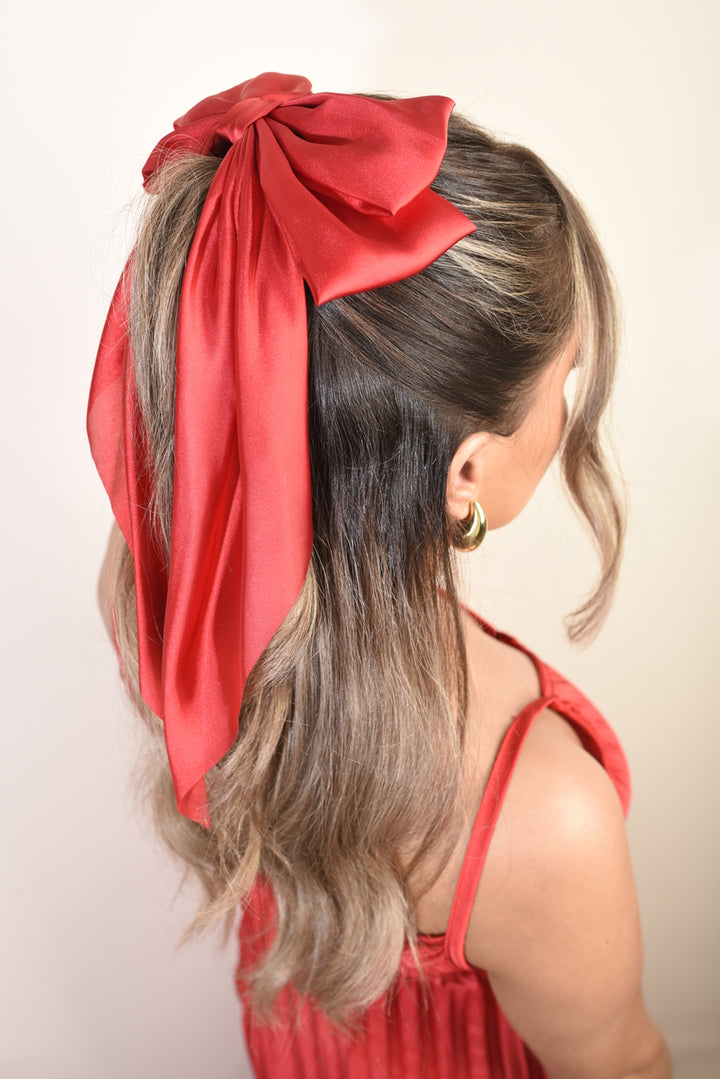 Elegant Big Bow Hair Clip in a woman's hair, showcasing its oversized and chic design, ideal for adding sophistication to any hairstyle.