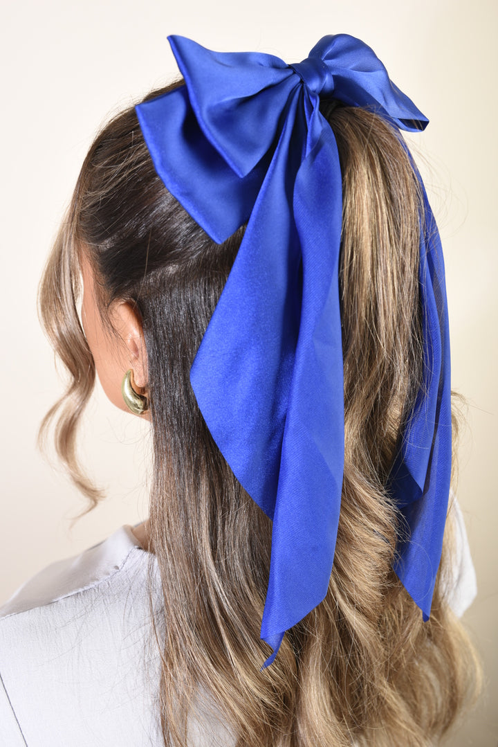 Elegant Big Bow Hair Clip adorning a woman's hair, showcasing its sophisticated style and perfect fit for enhancing various hairstyles.