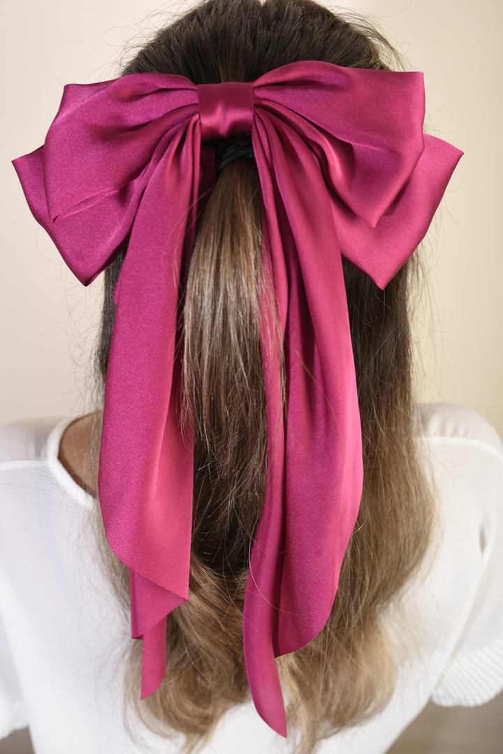 Elegant Big Bow Hair Clip showcased in a woman's hair, highlighting its chic and sophisticated design, perfect for enhancing any hairstyle with style and charm.