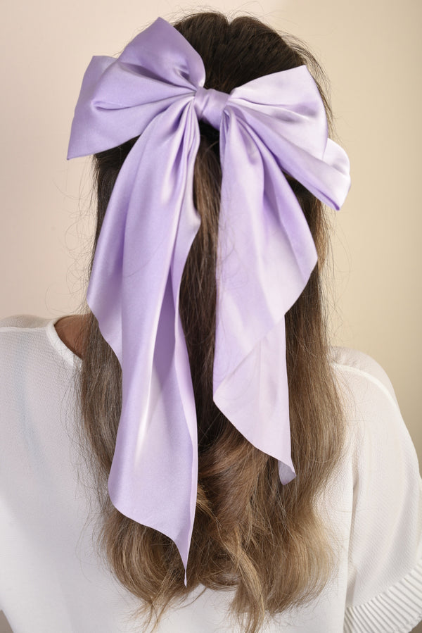 Elegant Big Bow Hair Clip adorning a woman's hair, showcasing its sophisticated and chic design, perfect for elevating everyday or special occasion hairstyles.