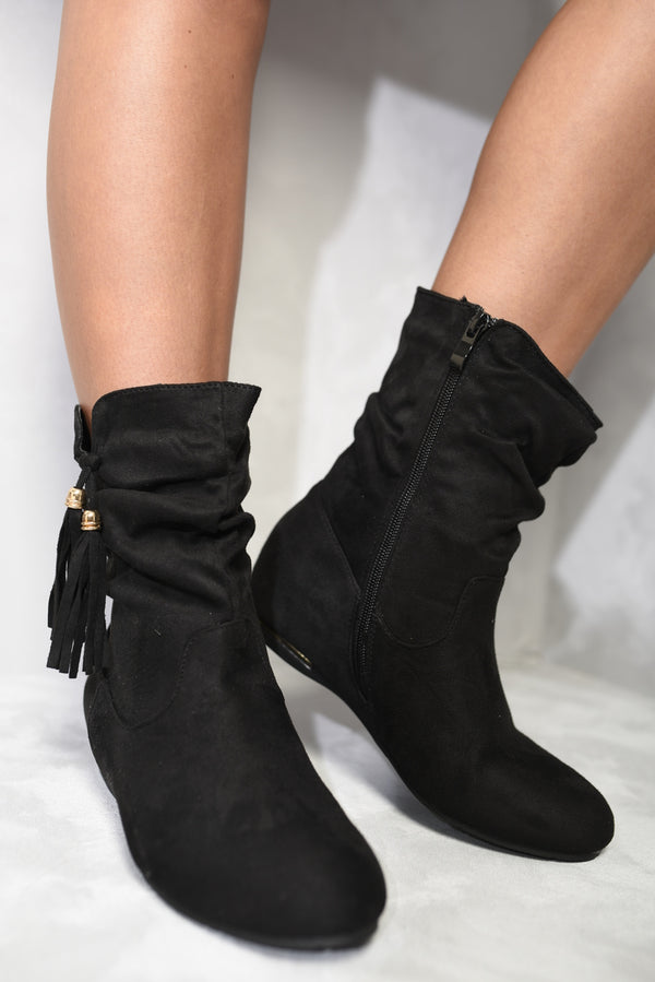 Tassle Detail Rouched Ankle Boots with ruched design and tassel, worn by a person, showcasing style and comfort for boho-chic fashion.