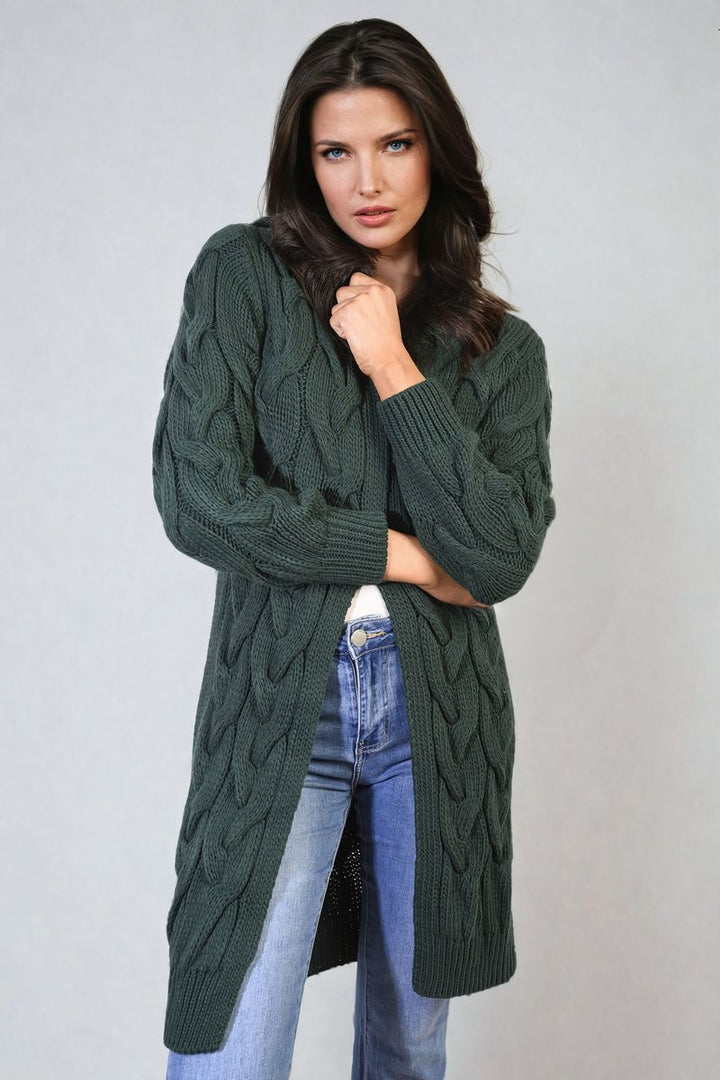 Woman wearing the Chunky Cable Knitted Oversized Longline Hooded Cardigan, perfect for cozy layering from Holiday Clothes UK.