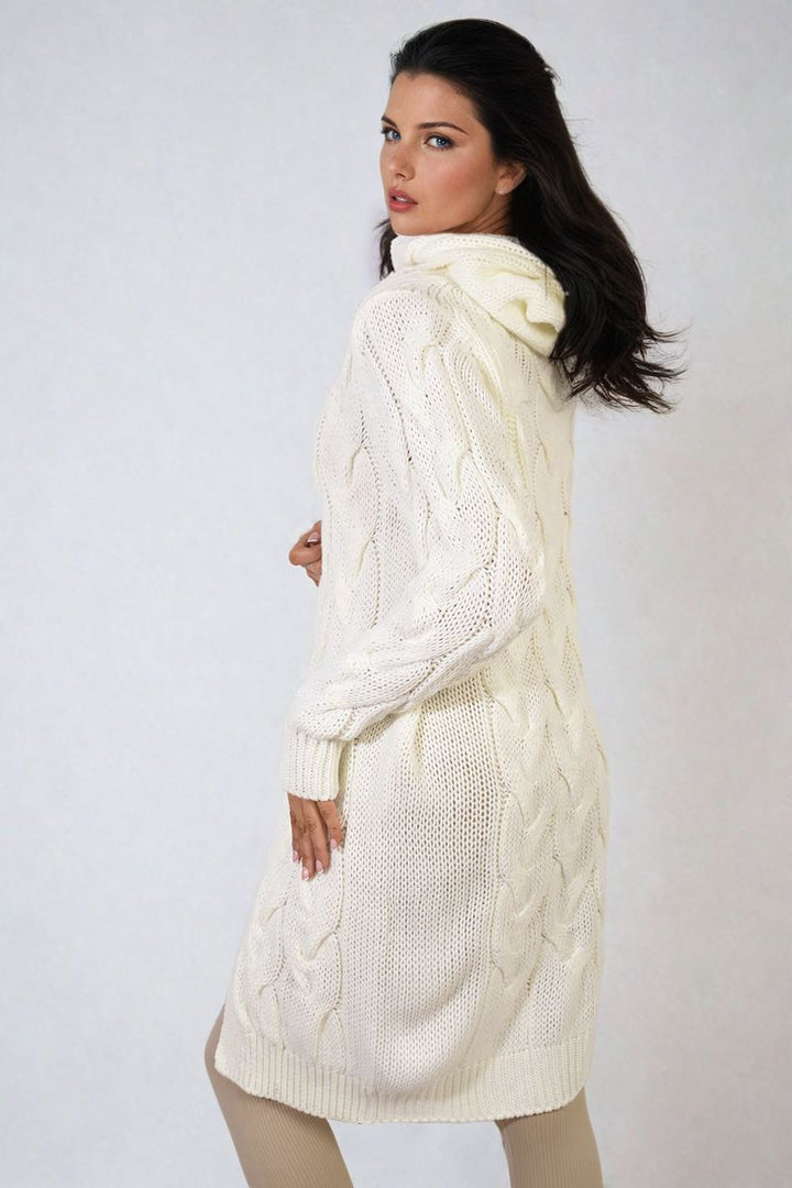 Woman wearing the Chunky Cable Knitted Oversized Longline Hooded Cardigan, showcasing its cozy, layered design ideal for stylish, comfortable wear.