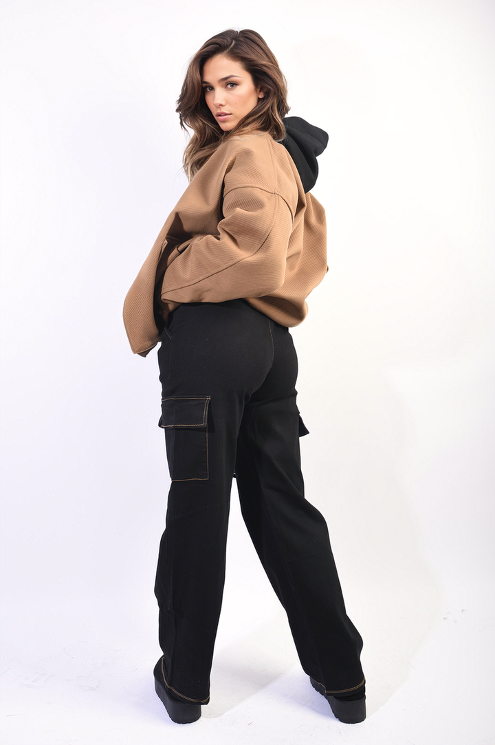 Woman wearing Zoey Drawstring Waist Flap Pocket Wide Leg Cargo Jeans, showcasing their relaxed fit and practical flap pocket design.