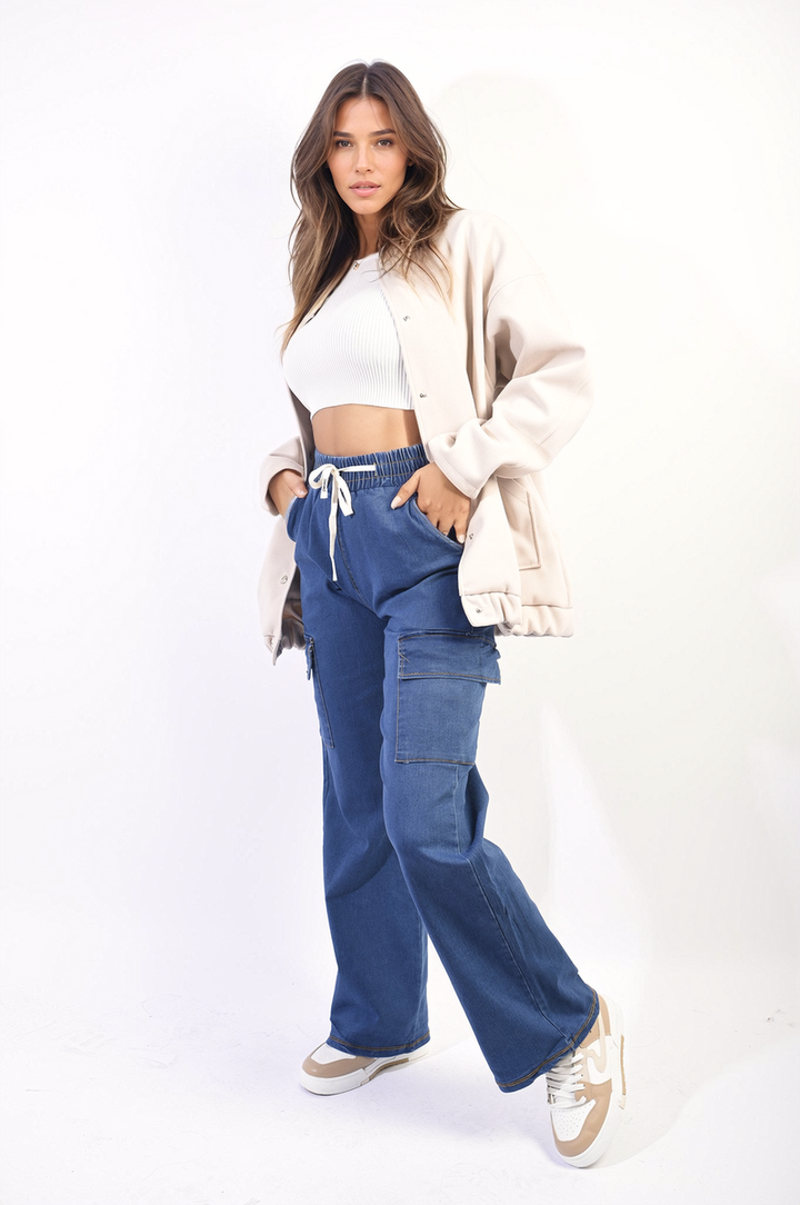 Woman wearing Drawstring Waist Flap Pocket Wide Leg Cargo Jeans, showcasing their relaxed fit and practical pocket design. Perfect for casual occasions and effortless style.