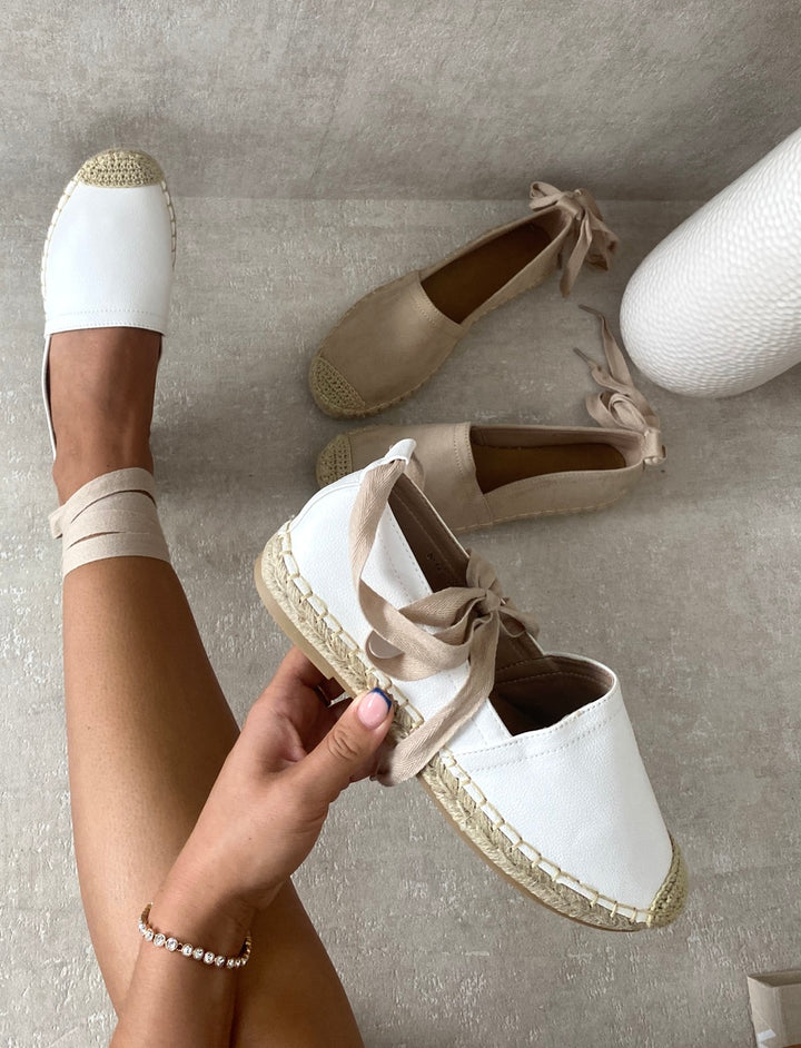 Person holding Zoey Tie Leg Espadrille Sandals with tie-leg design and espadrille sole, ideal for stylish summer outfits from Holiday Clothes UK.