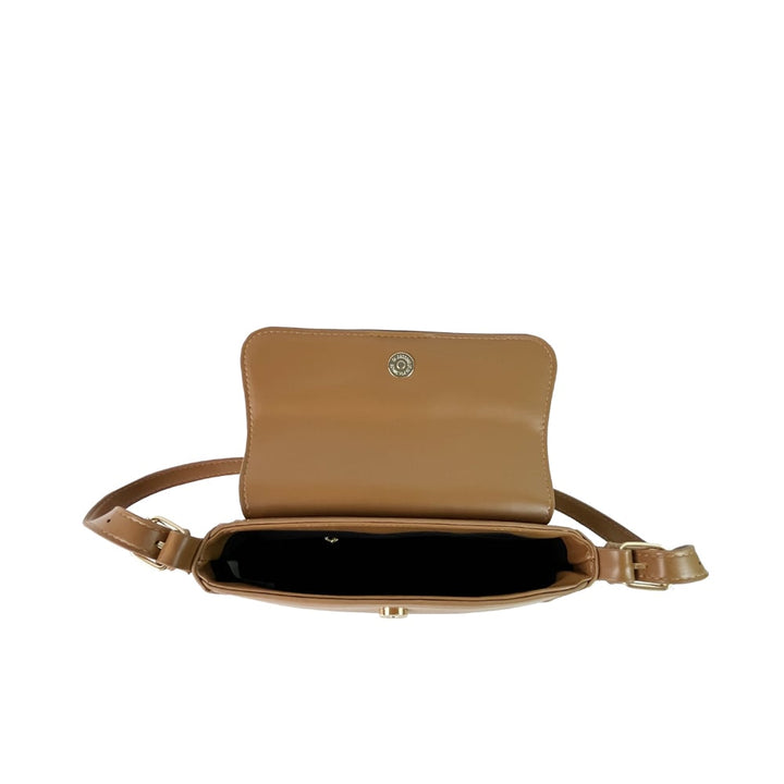 Amanda Shoulder Bag with a handle and silver button, offering a spacious interior and sophisticated hardware detail, ideal for transitioning from day to night.